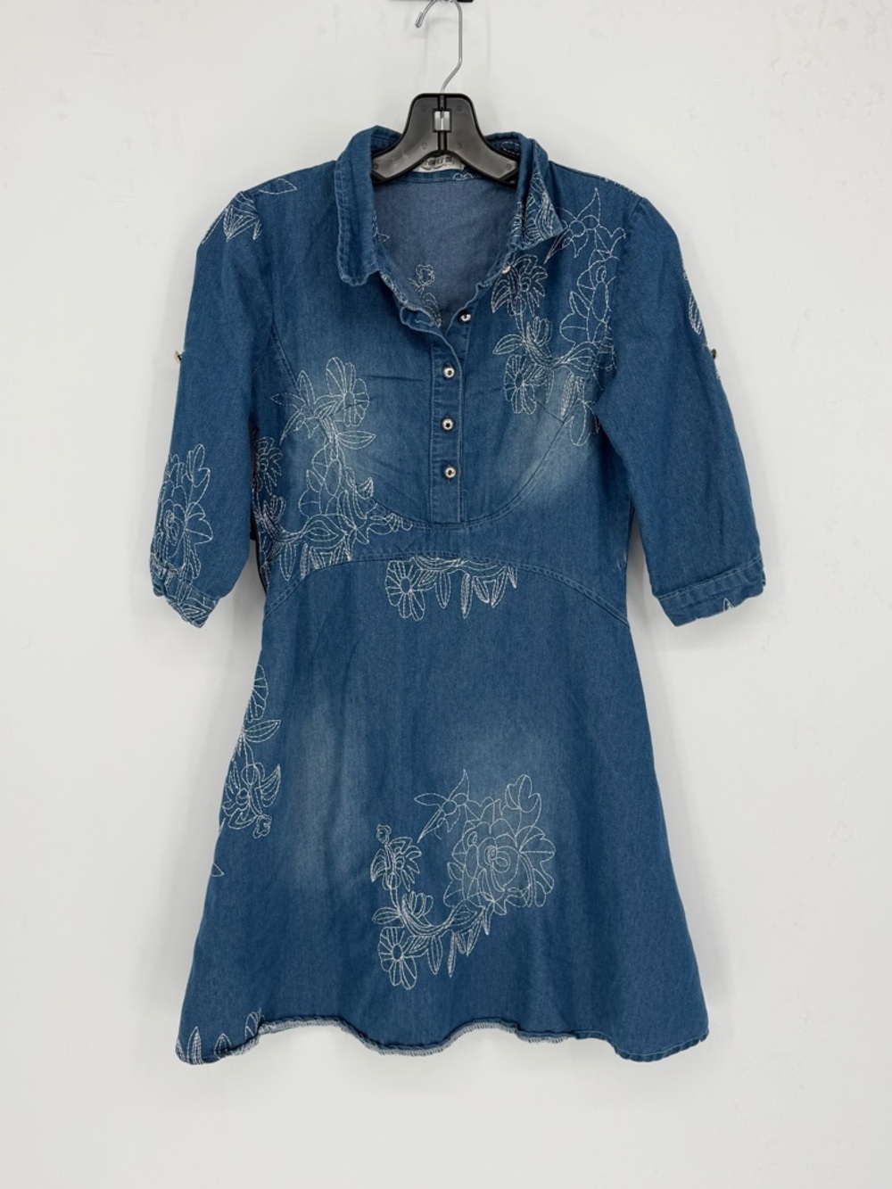 Denim dress featuring floral embroidery detail